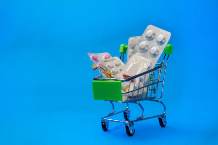 The concept of inflation in medicine. Medicine and money in the market basket. The increase in prices for medicines.の写真素材