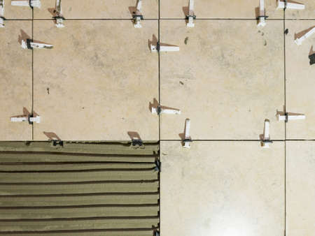 Tile Leveling Wedges, tile leveling system with plastic clips and wedges.の写真素材