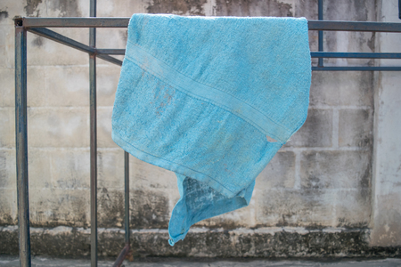 Old dirty blue torn ragの写真素材