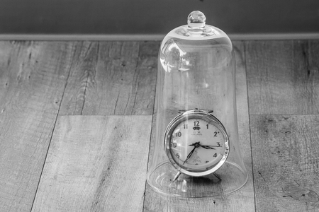 Time Management Concept : Close up red vintage alarm clock be distorted and damaged setting on...