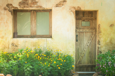 Vintage retro wooden window and door on old grunge brick wall.の写真素材