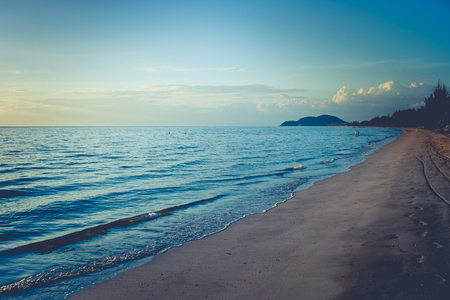 Beautiful seascape view of sand beach with sea and island in the background at twilight time at Chao Lao Beach, Chanthaburi Province, Thailand. (Selective focus)の写真素材