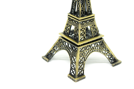 Close up architecture part of eiffel tower model isolated on white background. (Selective focus)の写真素材