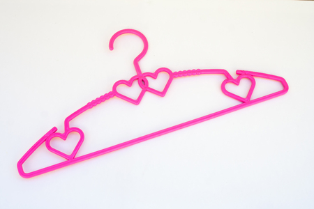 Top view of colorful clothes hangers isolated on white background. (Selective focus)の写真素材