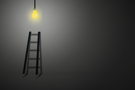 Business Idea Concept : Black ladder lead up to bright light bulb.の写真素材
