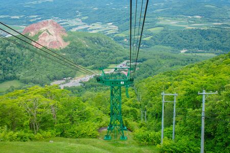 Ropeway or Cable car pillar system to transport people up to hill of Mount Usu at Hokkaido, Japan.の写真素材