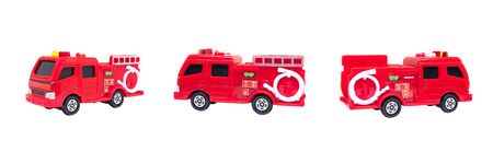 Group of red fire trucks isolated on white background.