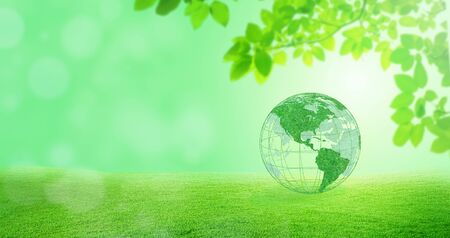Ecology and Environmental Concept : Green planet earth globe with green trees in background.の写真素材