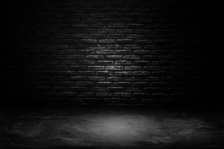 Abstract Black and White of Studio dark room black brick wall with concrete floor.の写真素材