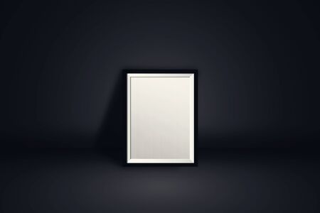 Picture or photo frame with empty blank white screen place on black wall background for advertising...