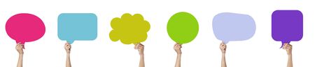 Business Communication Concept : Hands holding colorful speech bubble chat isolated on white background.の写真素材