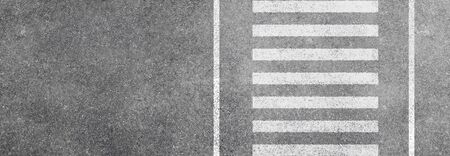 Abstract image aerial view of White pedestrian crosswalk or Zebra crossing on asphalt street road.の写真素材