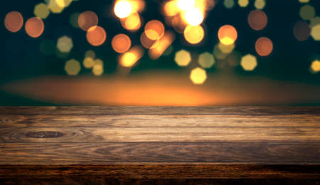 Side view of Empty wooden table top with beautiful light bokeh background for product showing.の写真素材