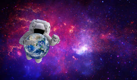 Blue planet earth in hand of Astronaut that floating in the space.の写真素材