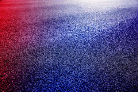 Abstract image of Empty wet asphalt road with neon light reflection background.の写真素材