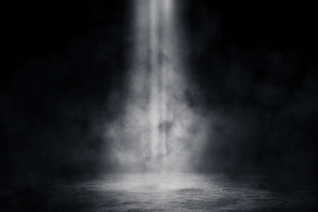 Empty space of Studio dark room with spot lighting and fog or mist on concrete floor in black...