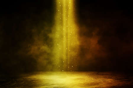 Empty space of Studio dark room with golden spot lighting effect and fog or mist on concrete floor...
