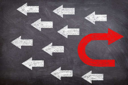 Different Thinking, Individual and Standing Out Concept : Red arrow facing opposite direction white...