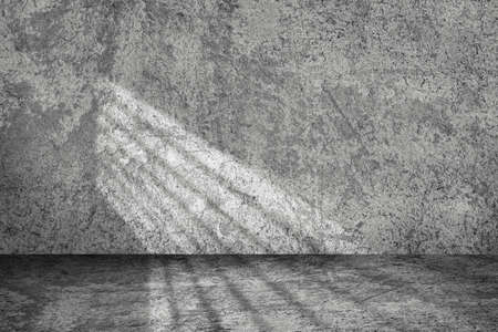 Empty space studio room of Plaster cement concrete wall grunge texture background with light shading.の写真素材