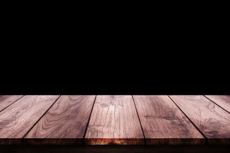 Side view of Empty wooden table top with black background for product showing.の写真素材