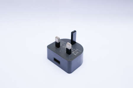 Black USB charger isolated on white background