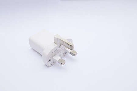 white charger isolated on white backgroundの写真素材