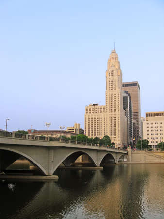 Downtown buildings, Broad Street Bridge, and the Scioto River in Columbus, Ohio.の写真素材