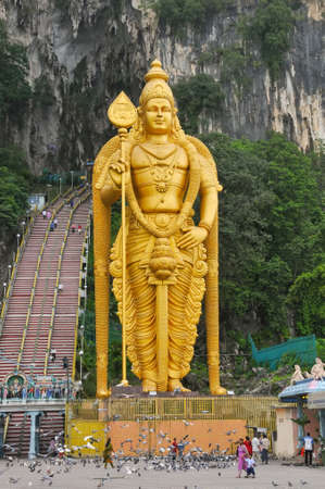 A giant gold statue of Lord Muruga stands outside the Batu Caves, a Hindu holy site, near Kuala Lumpur, Malaysia.のeditorial素材