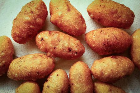 Deep fired Vietnamese rice balls are served with fillings of mince meat, carrot, vermicelli, and...