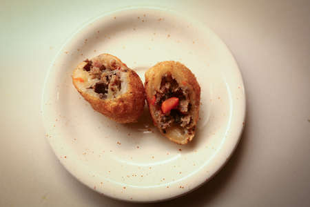 Deep fired Vietnamese rice balls are served with fillings of mince meat, carrot, vermicelli, and cloud ear fungus の写真素材