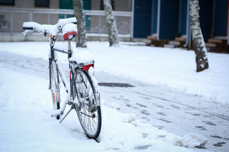 Bicycle with a thick snow in a winter dayの写真素材