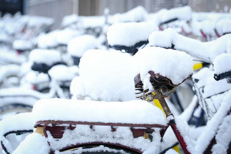 Bicycle with a thick snow in a winter dayの写真素材