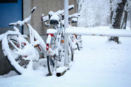 Bicycle with a thick snow in a winter dayの写真素材