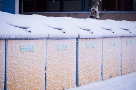 Recycle area is covered by snow in a winter dayの写真素材
