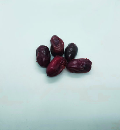 close up view of fresh dates isolated in white background , healthy eatand foodの写真素材