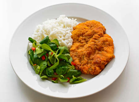 Wiener schnitzel with salad and rice