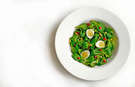 Spring salad, spinach and quail eggの写真素材