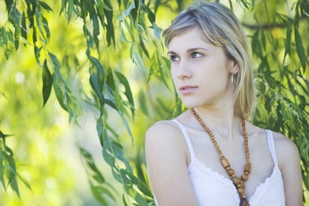 Girl s portrait in the willow leaves
