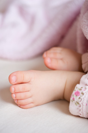 Feet of a sleeping five months old babyの写真素材