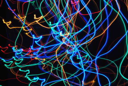 Multicolored light moving in the dark.
