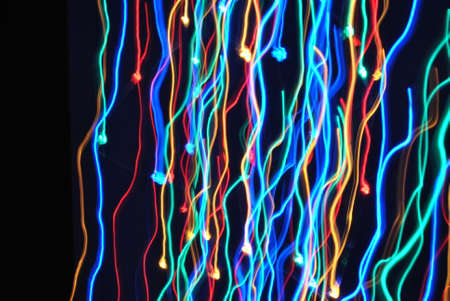 Multicolored light moving in the dark.の写真素材