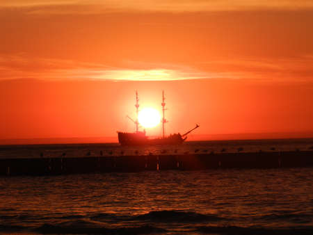 Beautiful sunset on the Baltic Sea. A walk along the seashore during your vacation. Perfect wallpaper.の写真素材