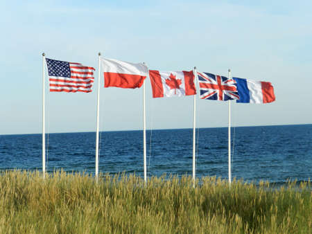 Flags on the seashore. Gulf of Gdansk.