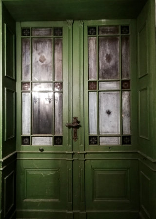 Beautiful old door in an ancient house, mansion. Beautiful texture.