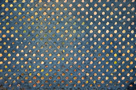 Metal grate in the basement of an old house. Interesting pattern.