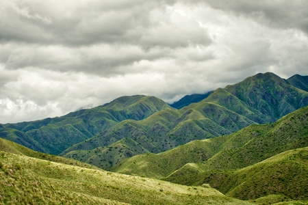 Mountainous silhouettes with stormy skyの写真素材
