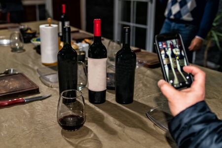 The concept of wine consumption. Wine bottles, glasses. Bottles of wine with space to writing.Space to write text.の写真素材