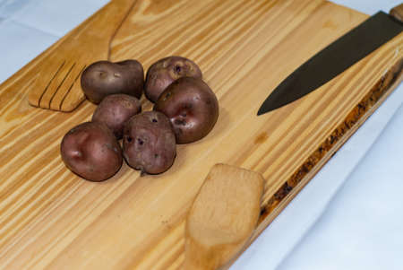 regional potatoes from the Andes at a market in Peru, Bolivia, Argentina, south america on a wooden table. Selective focusの写真素材