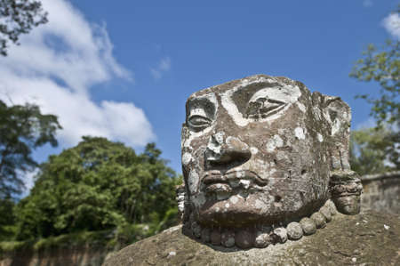 Heads of the guardians of Angkor Thom within the Angkor Temples, Cambodiaの写真素材
