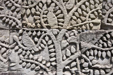 Details on the walls of Bayon within the Angkor Temples, Cambodiaの写真素材